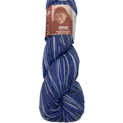 Blue and white skein of yarn with a label on a white background