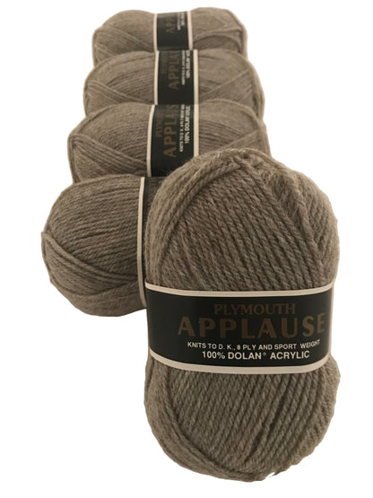Four skeins of Plymouth Applause yarn on a white background