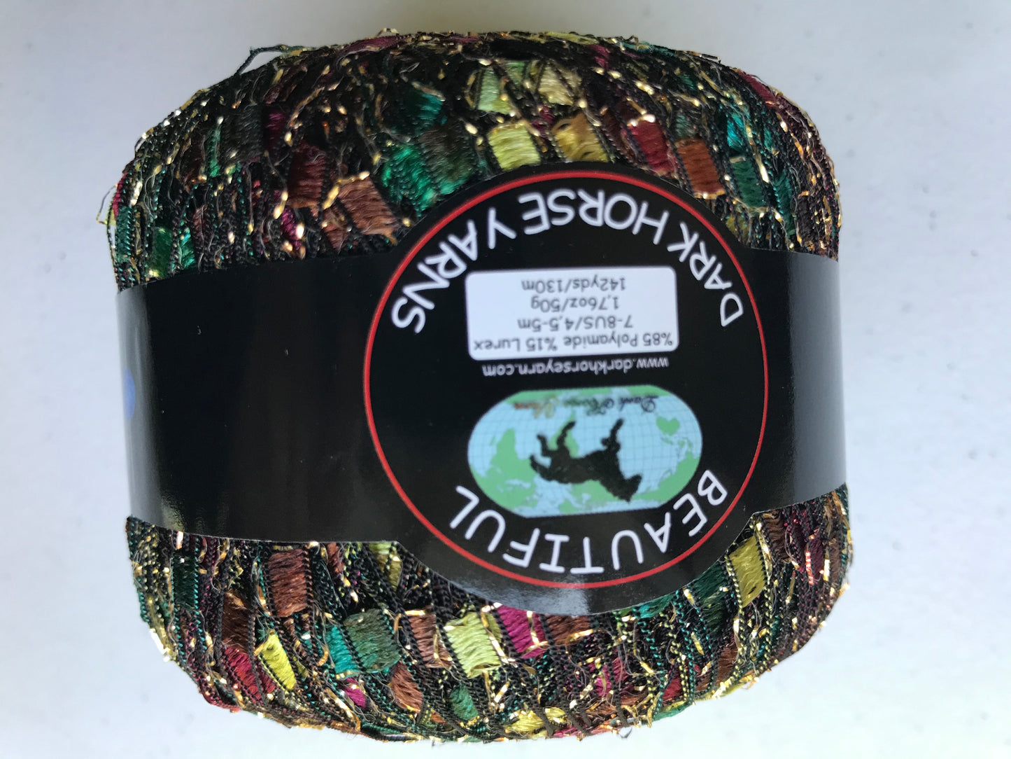 Multicolored yarn ball with a label on a white background