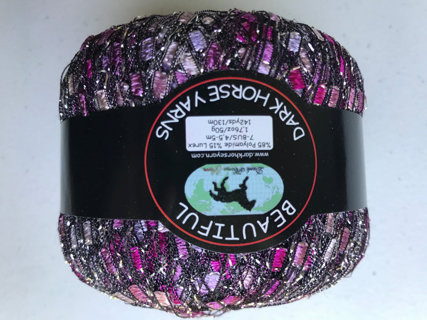 Multicolored yarn ball with 'Dark Horse Yarns' label on a white background