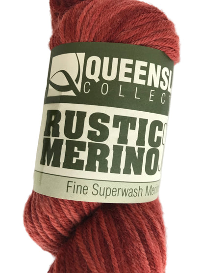 Red skein of yarn with a label on a white background