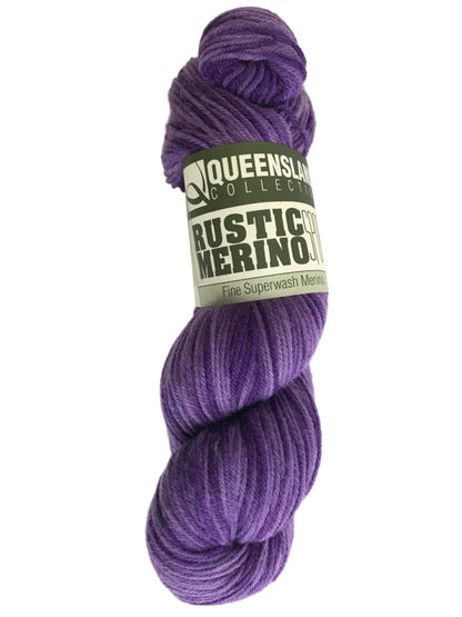 Purple skein of yarn with a label on a white background