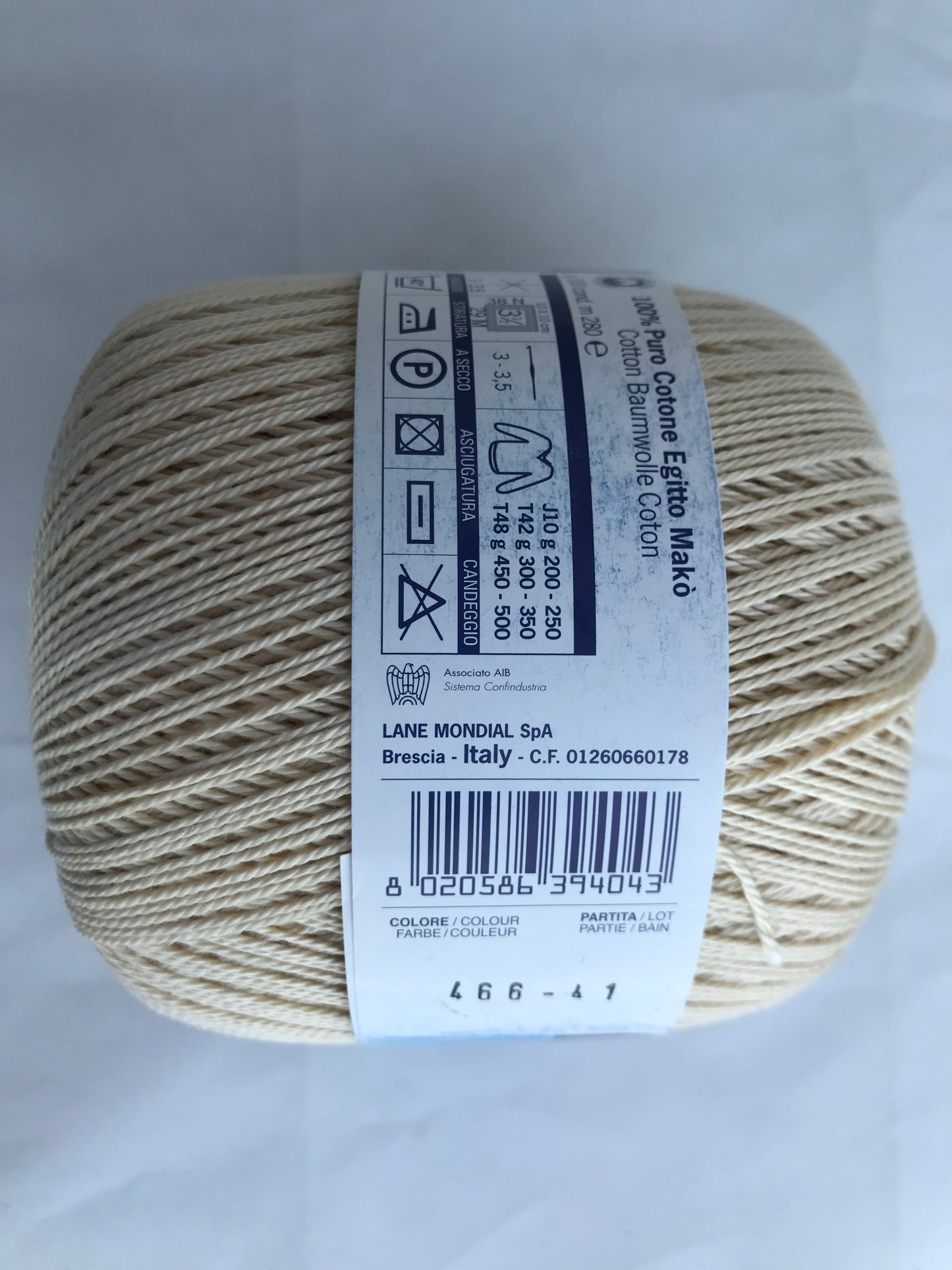 Ball of yarn with a label on a white background
