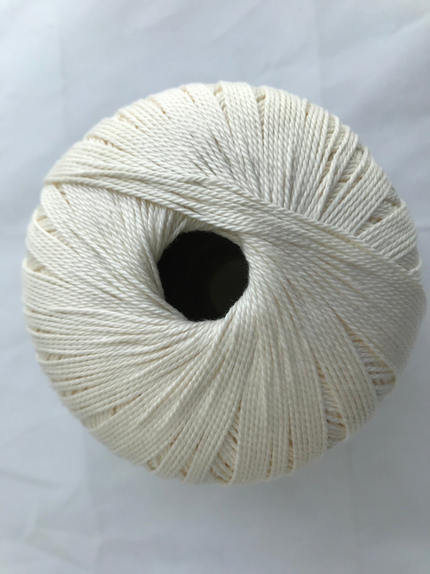 White skein of yarn on a white background