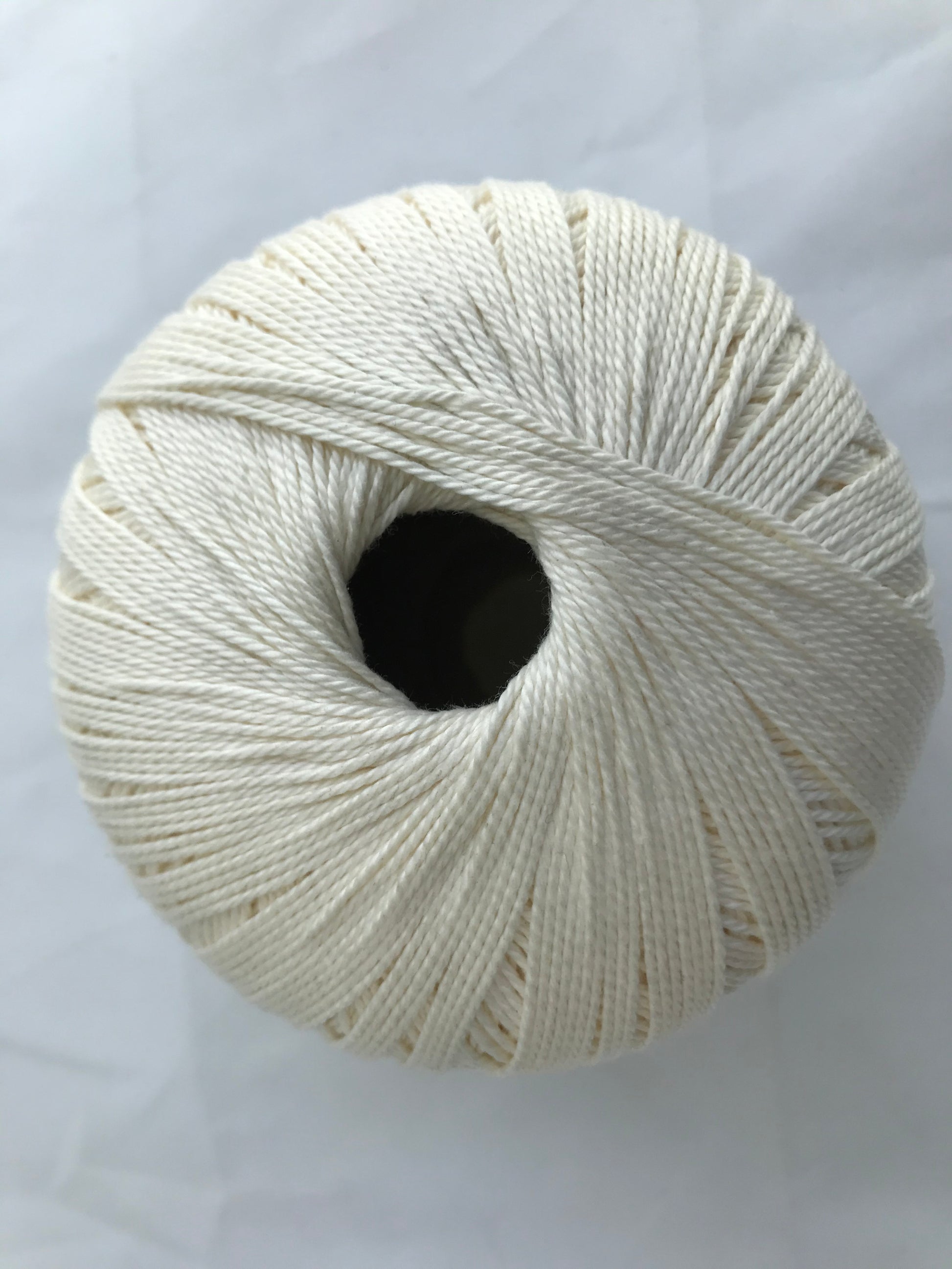 White skein of yarn on a white background