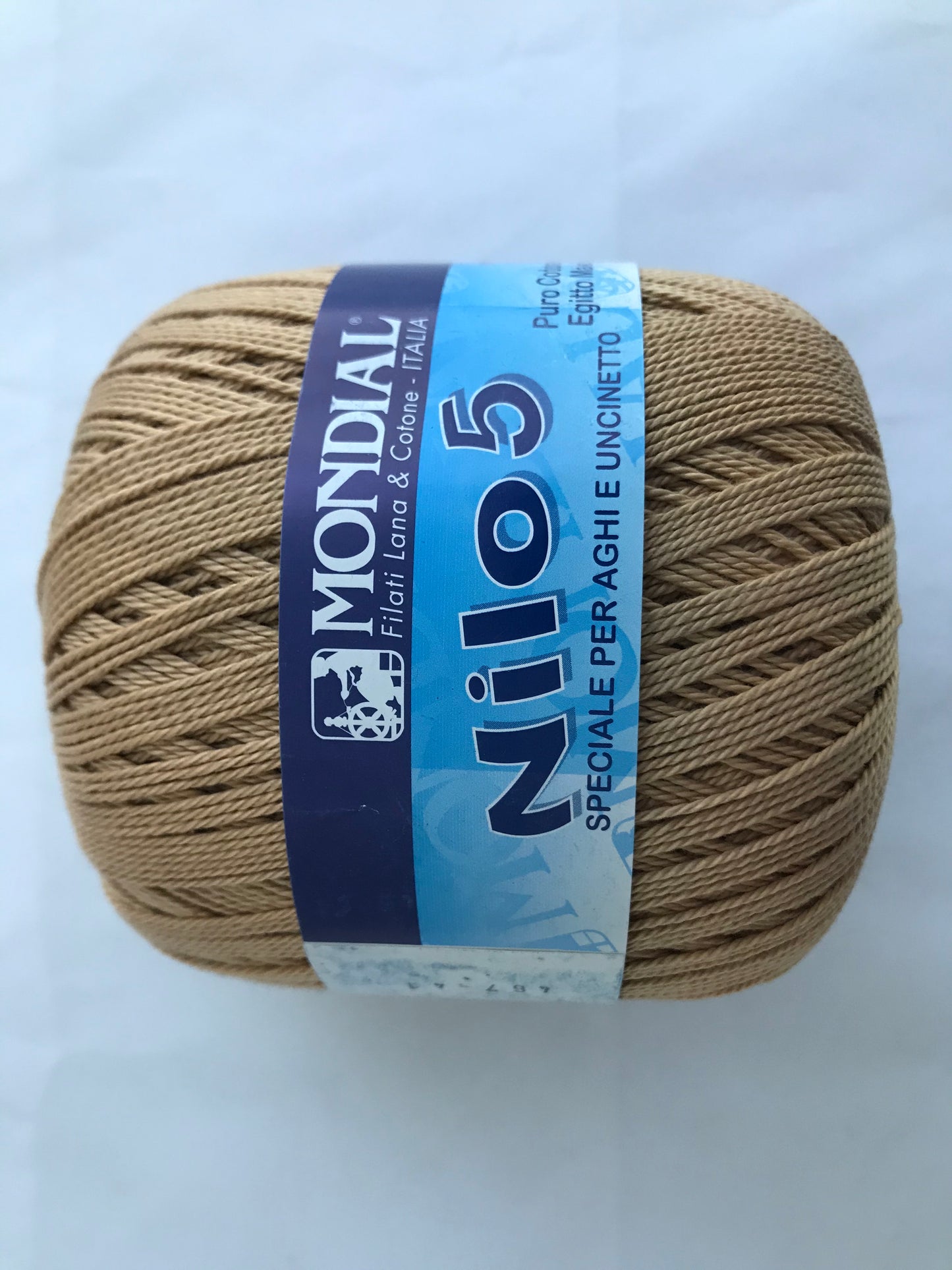 Ball of yarn with Mondial Nilo 5 label on a white background