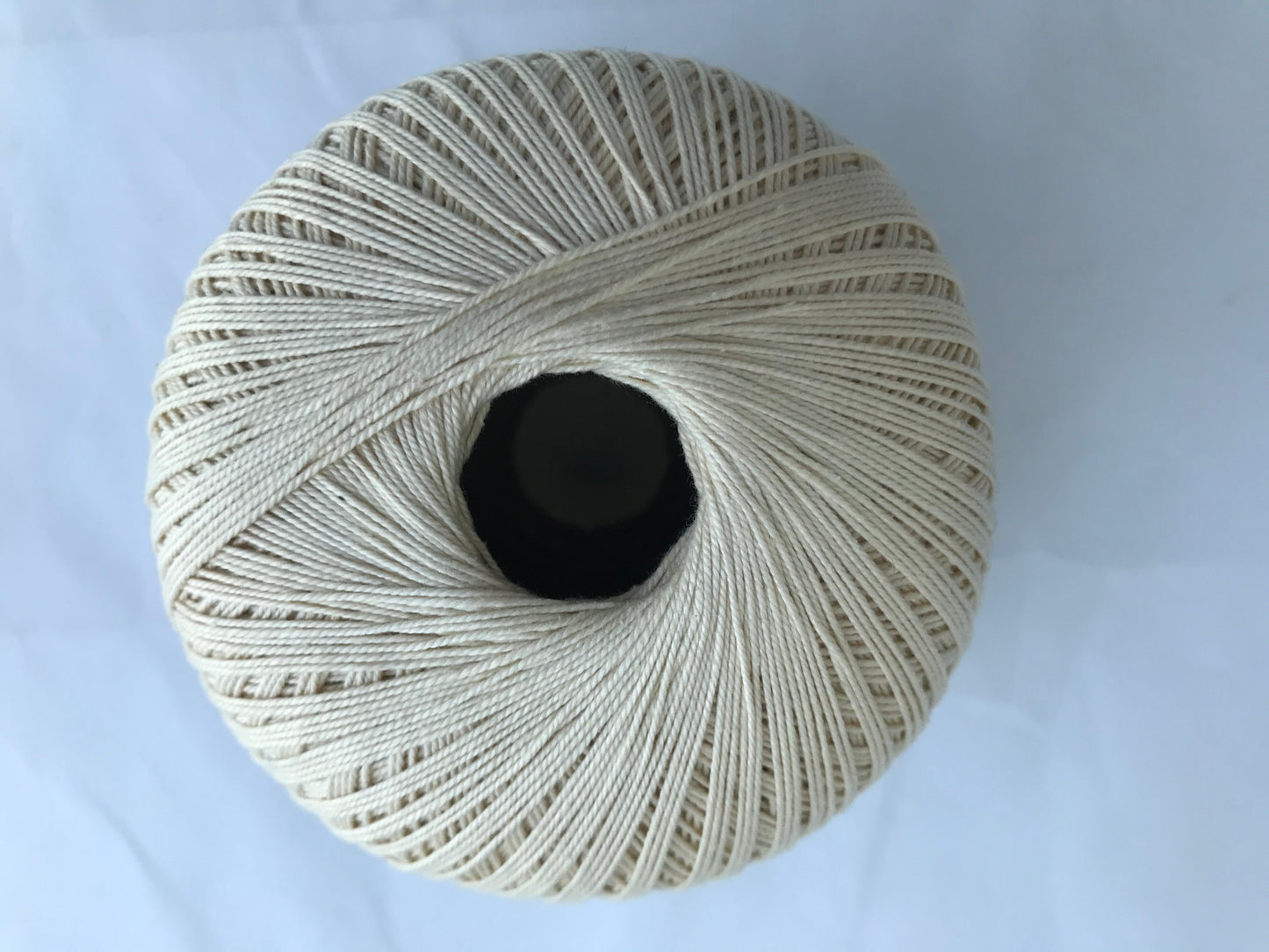 Ball of yarn on a light blue background