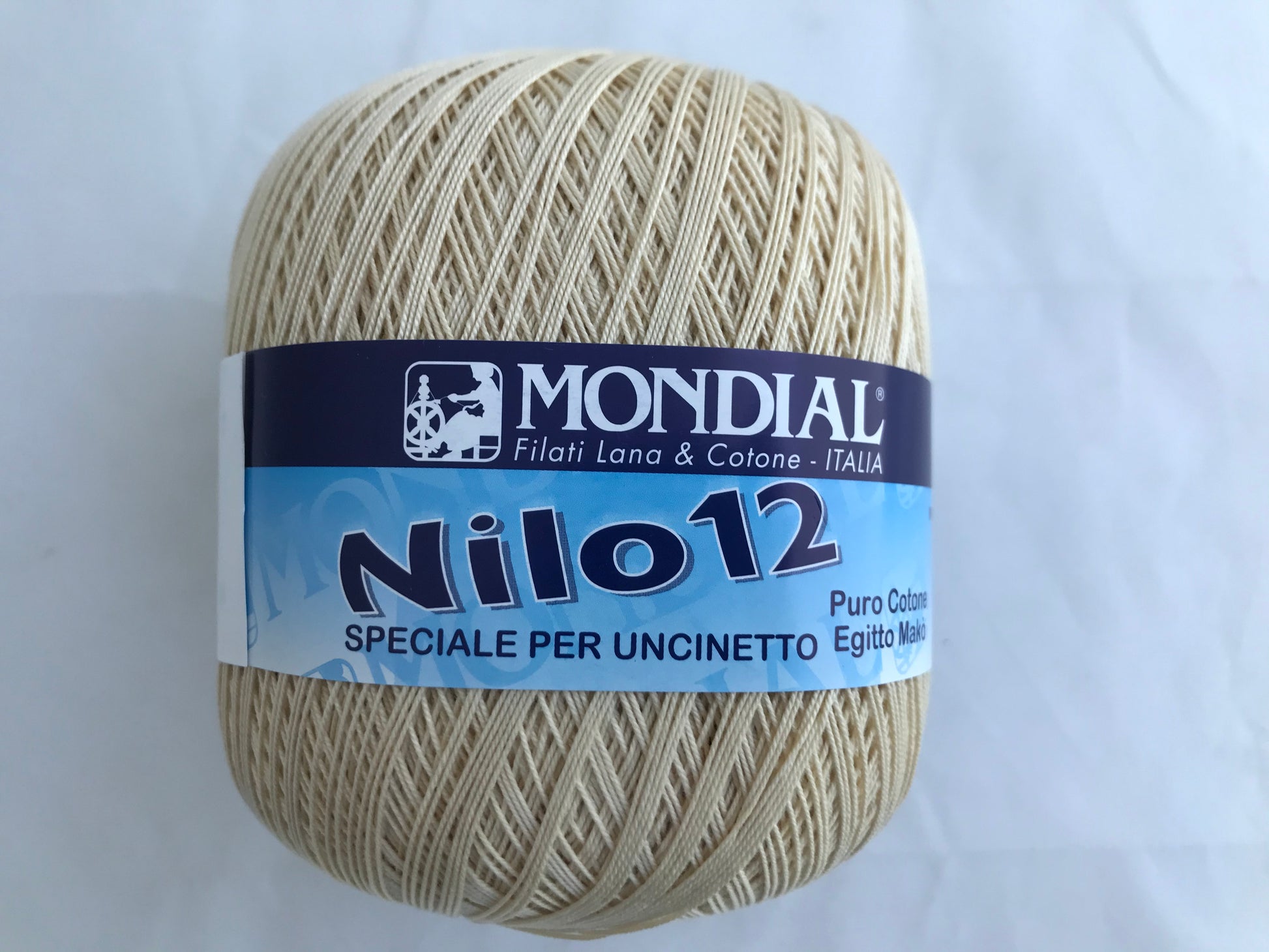 Ball of yarn with Mondial Nilo 12 label on a light gray background