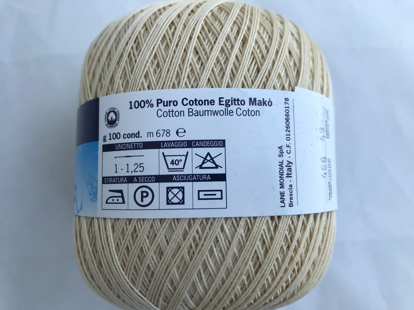Ball of yarn with a label on a white background
