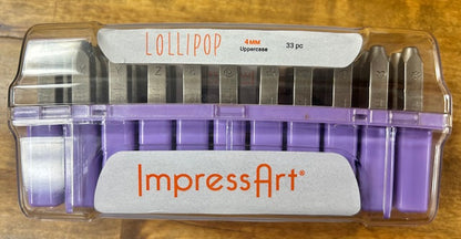 A purple case containing a set of ImpressArt Lollipop Uppercase Letters 4mm Metal Stamps. 