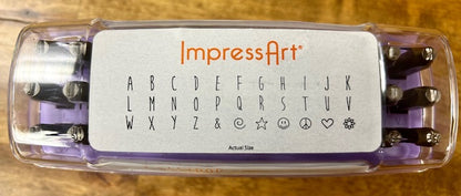 A purple case containing a set of ImpressArt Lollipop Uppercase Letters 4mm Metal Stamps. 