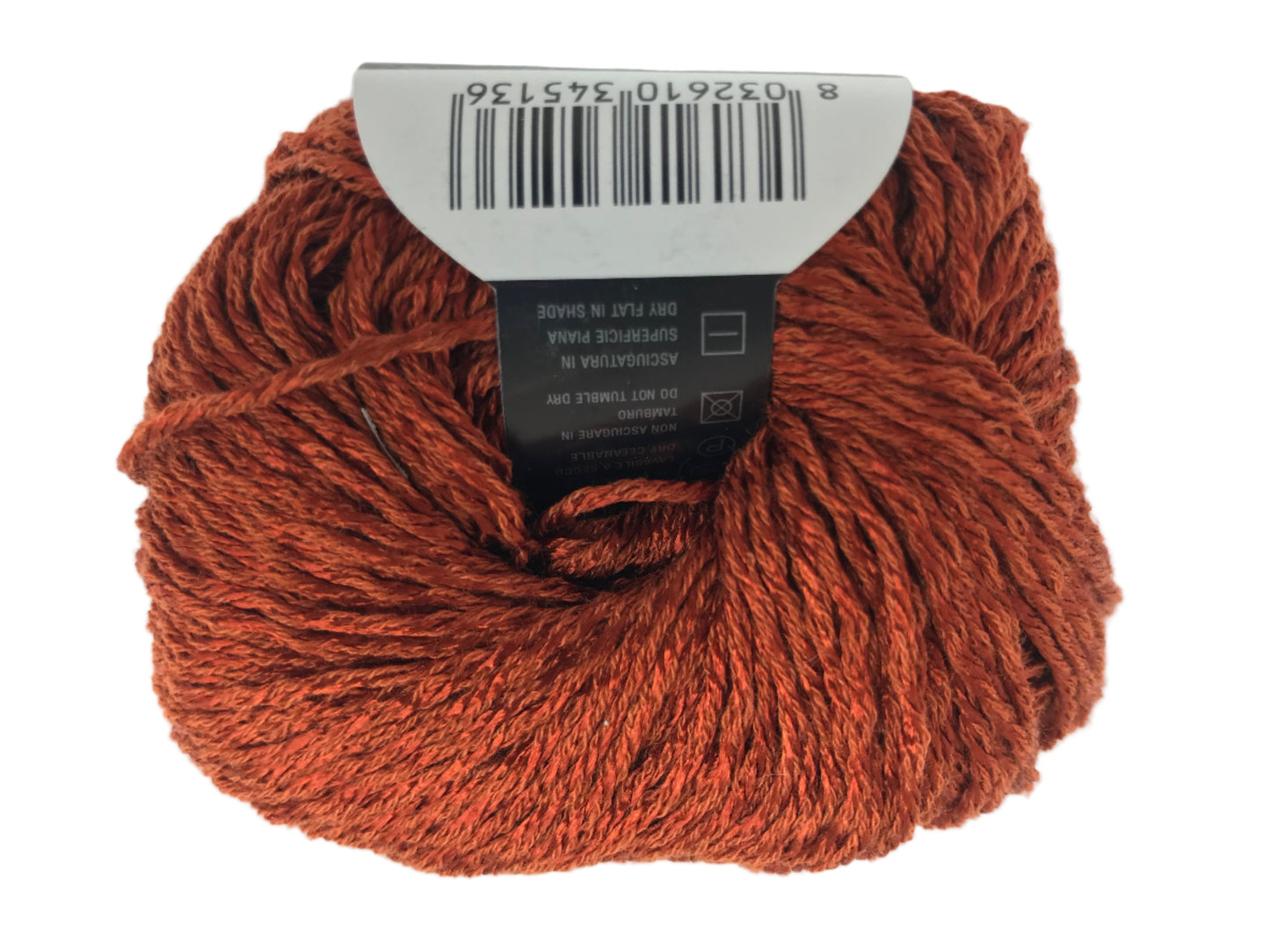 Ball of rust-colored yarn with a label on a white background