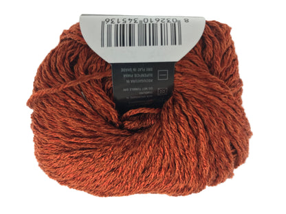 Ball of rust-colored yarn with a label on a white background