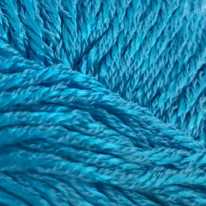 Blue skein of yarn with a label on a white background