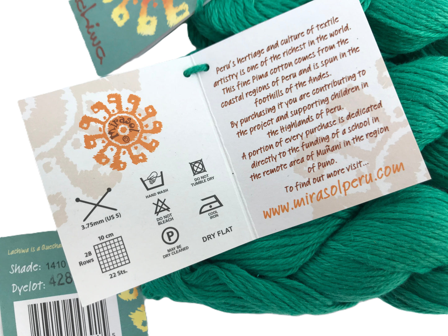 Teal yarn with a label detailing product information and branding