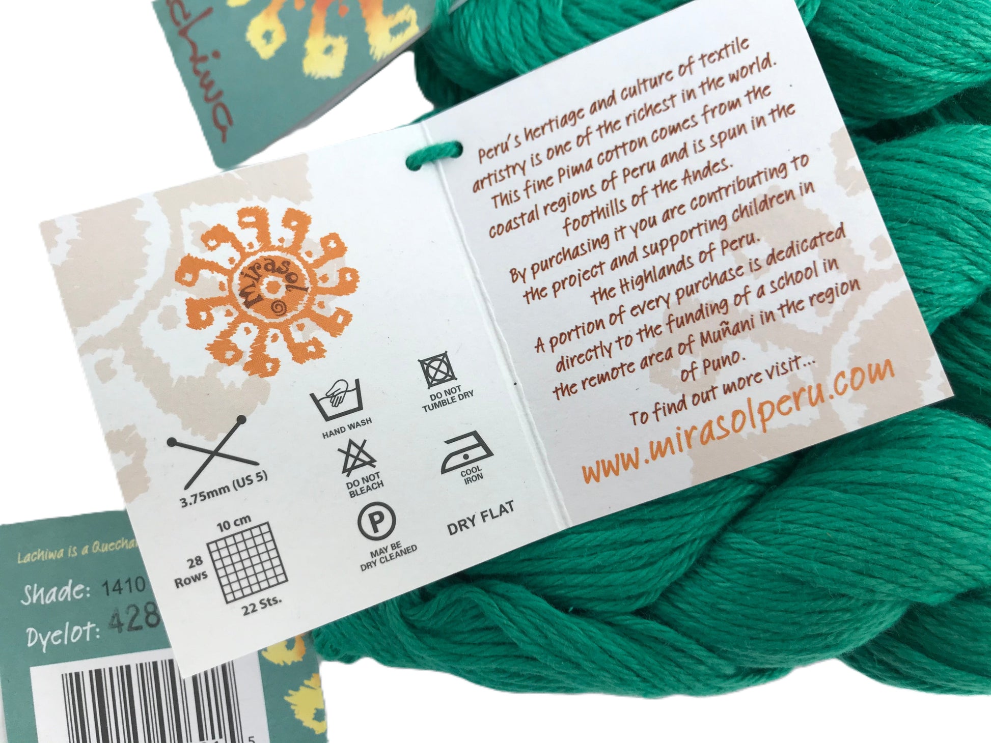 Teal yarn with a label detailing product information and branding