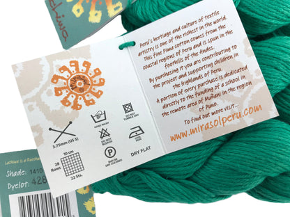 Teal yarn with a label detailing product information and branding