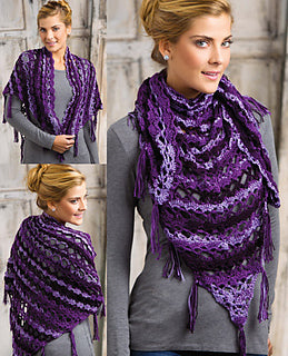 Woman wearing a purple knitted shawl with a gray background