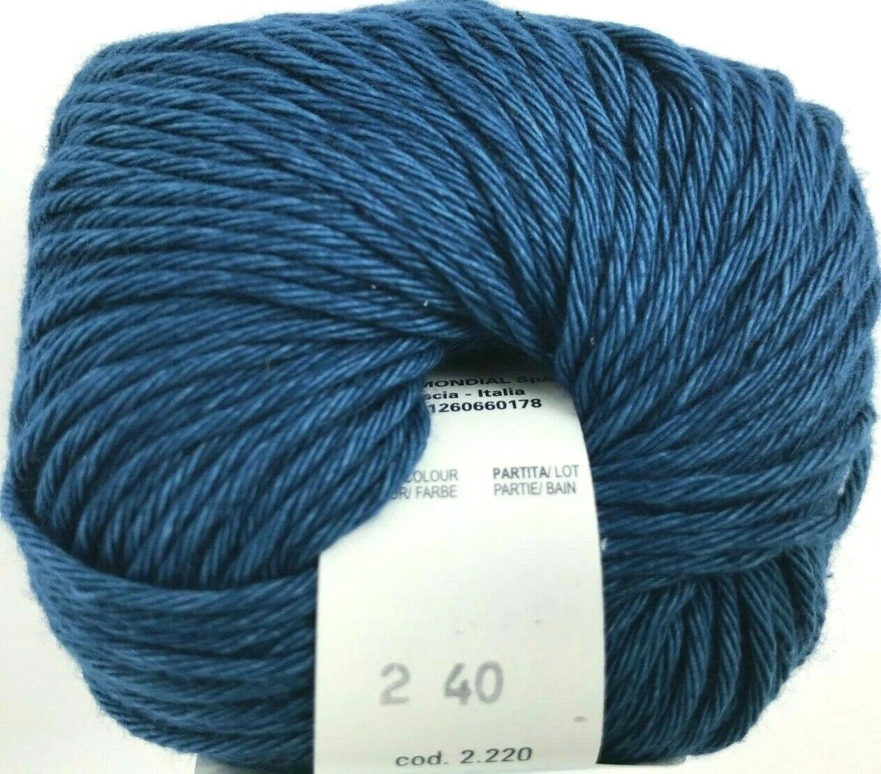 Blue skein of yarn with a label on a white background