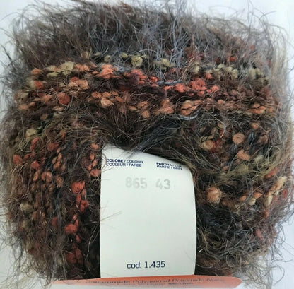 Multicolored yarn ball with a label on a white background
