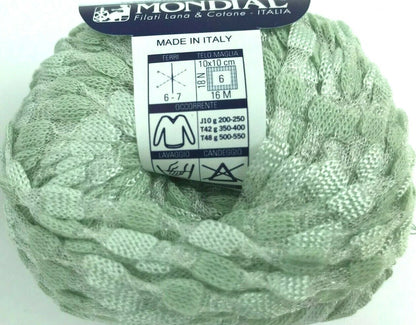 Ball of green yarn with a Mondial label on a white background