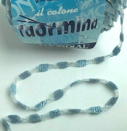 Ball of yarn with a blue label on a white background
