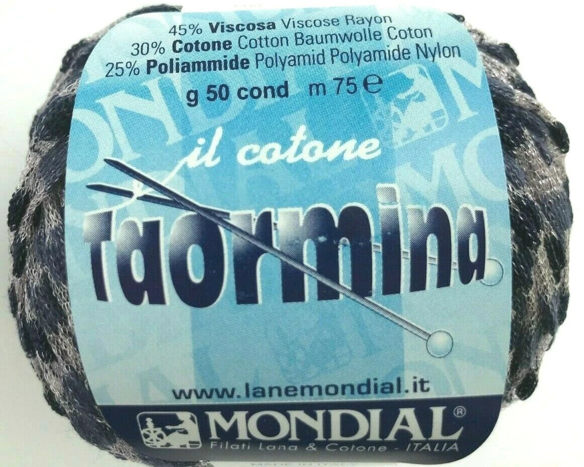 Ball of yarn with 'Mondial' label and yarn needle on a white background