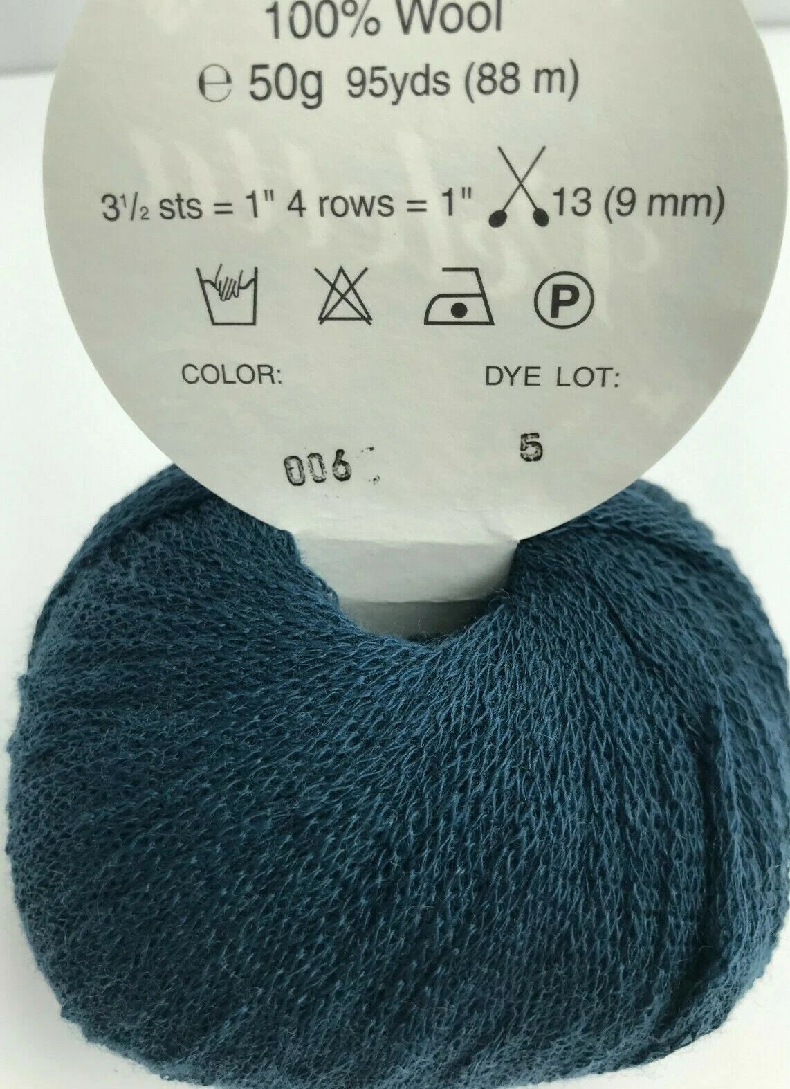 Blue yarn ball with label on a white background