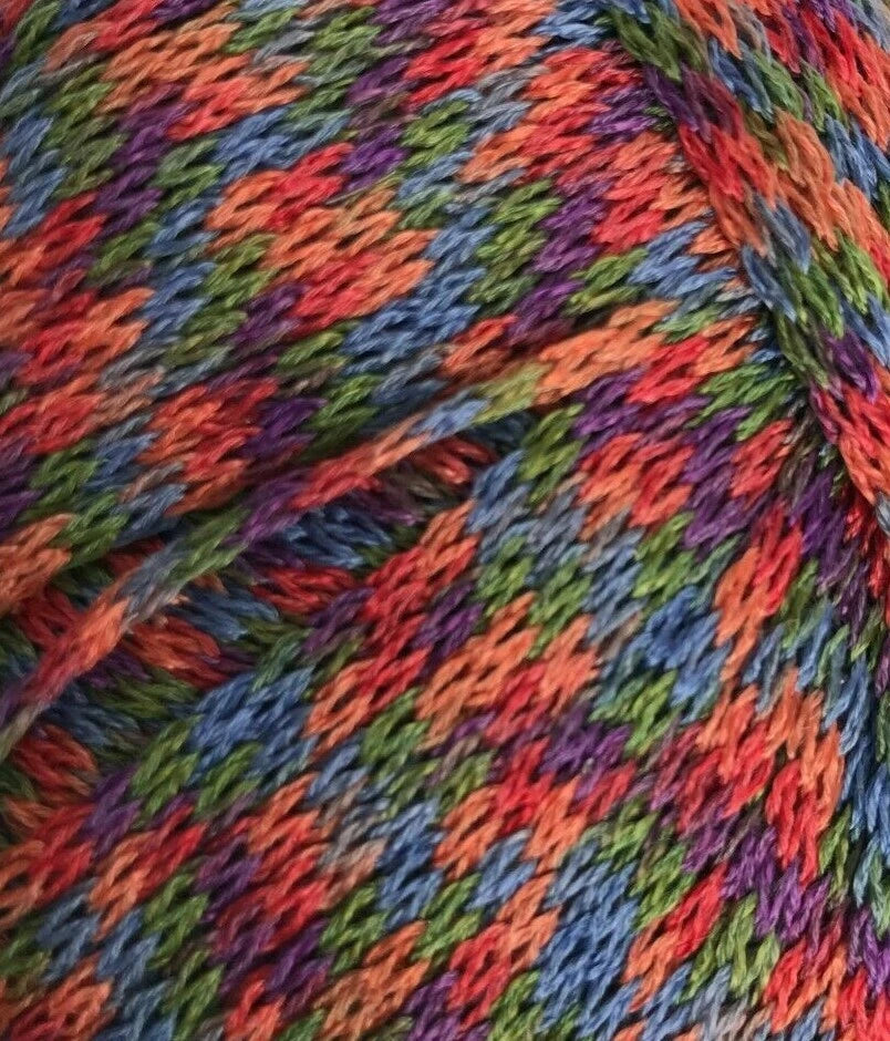 Multicolored yarn ball with a pattern of red, blue, green, and purple.