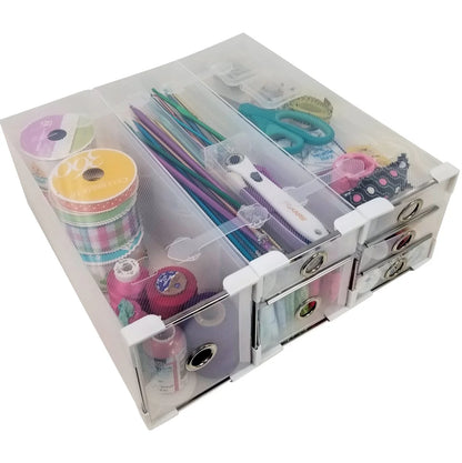 Clear sewing kit with various tools and materials on a white background