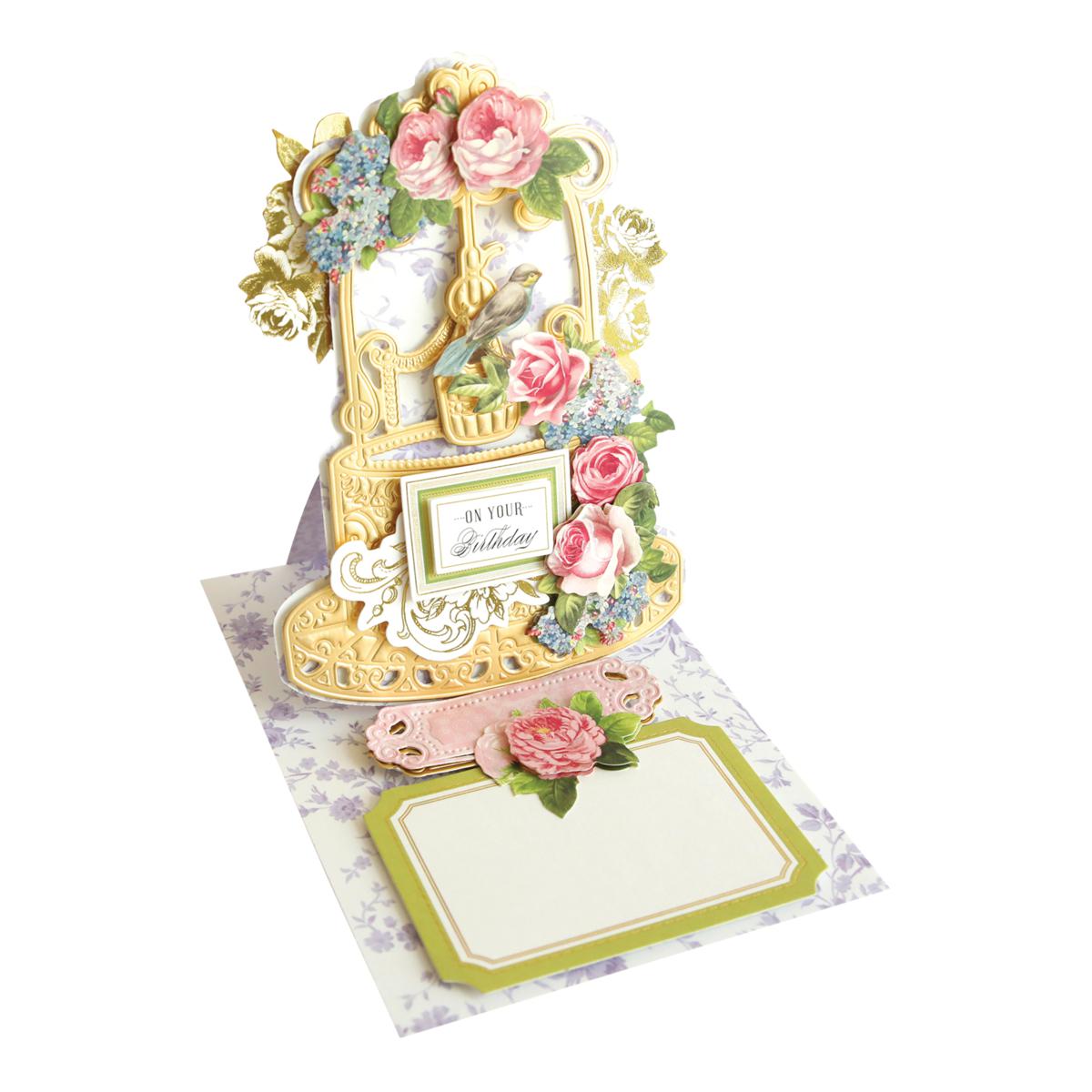 Decorative birthday card with floral design and gold frame on a white background