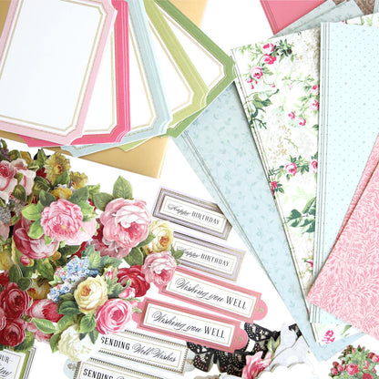 Collection of decorative paper sheets with floral and text designs.