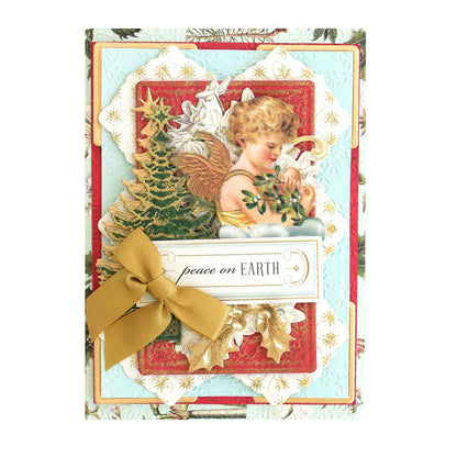 A handmade Christmas card featuring an angel and the text 'peace on EARTH.