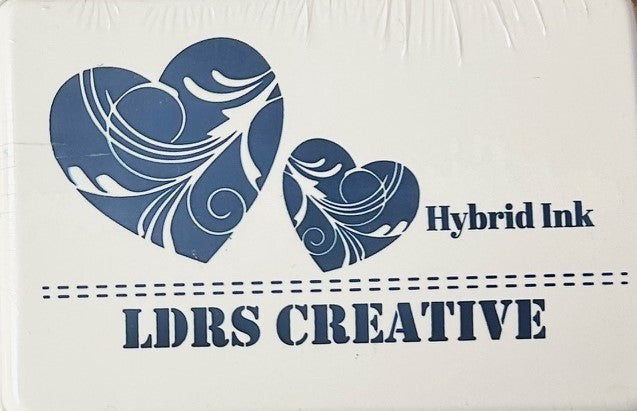 An image of a white ink pad featuring two blue-colored hearts with white decorative swirls and the text "LDRS CREATIVE Hybrid Ink" in blue.
