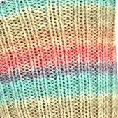 Close-up of a knitted fabric with multicolored stripes