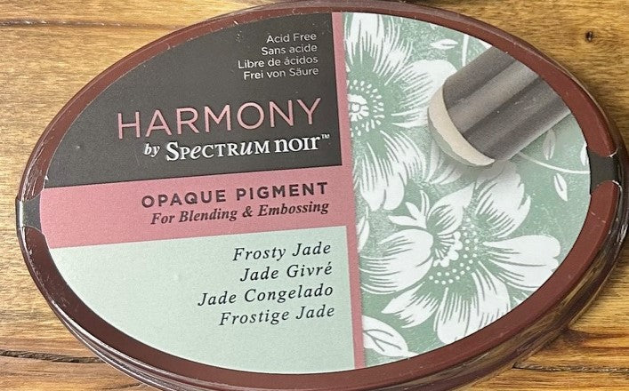 A Spectrum Noir Harmony Opaque Pigment Inkpad in the color Frosty Jade, which is a vivid, opaque, slow-drying, acid-free, and archival ink perfect for blending and embossing