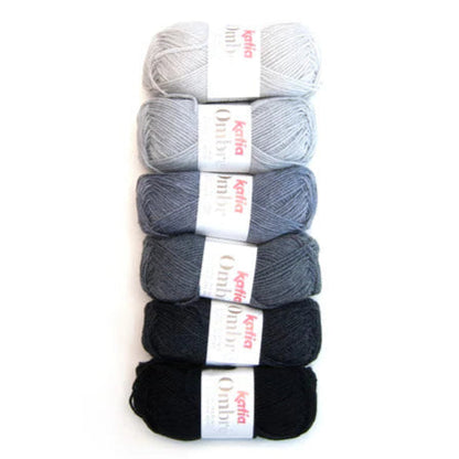 Set of five skeins of yarn in gray, black, and white on a white background