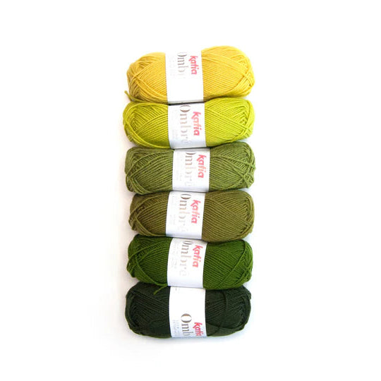 Six skeins of yarn in yellow and green shades with 'kgflea' labels on a white background.