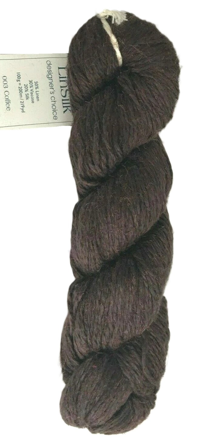 Brown skein of yarn with a label on a white background