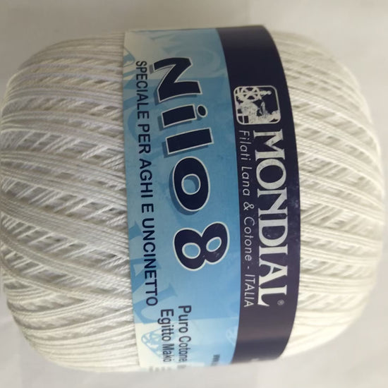 Ball of yarn with Mondial Nilo 8 label on a light gray background