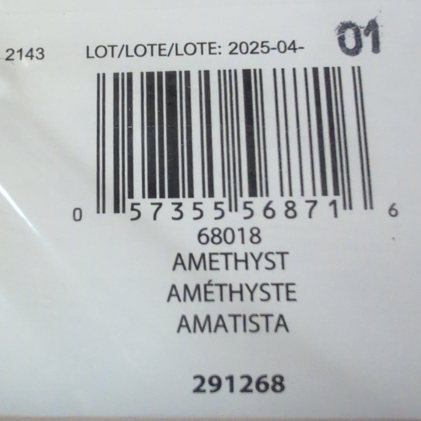 Close-up of a product label with a barcode and text on a textured surface.
