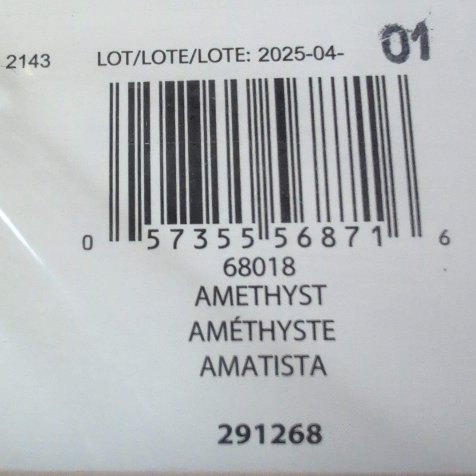 Close-up of a product label with a barcode and text on a textured surface.