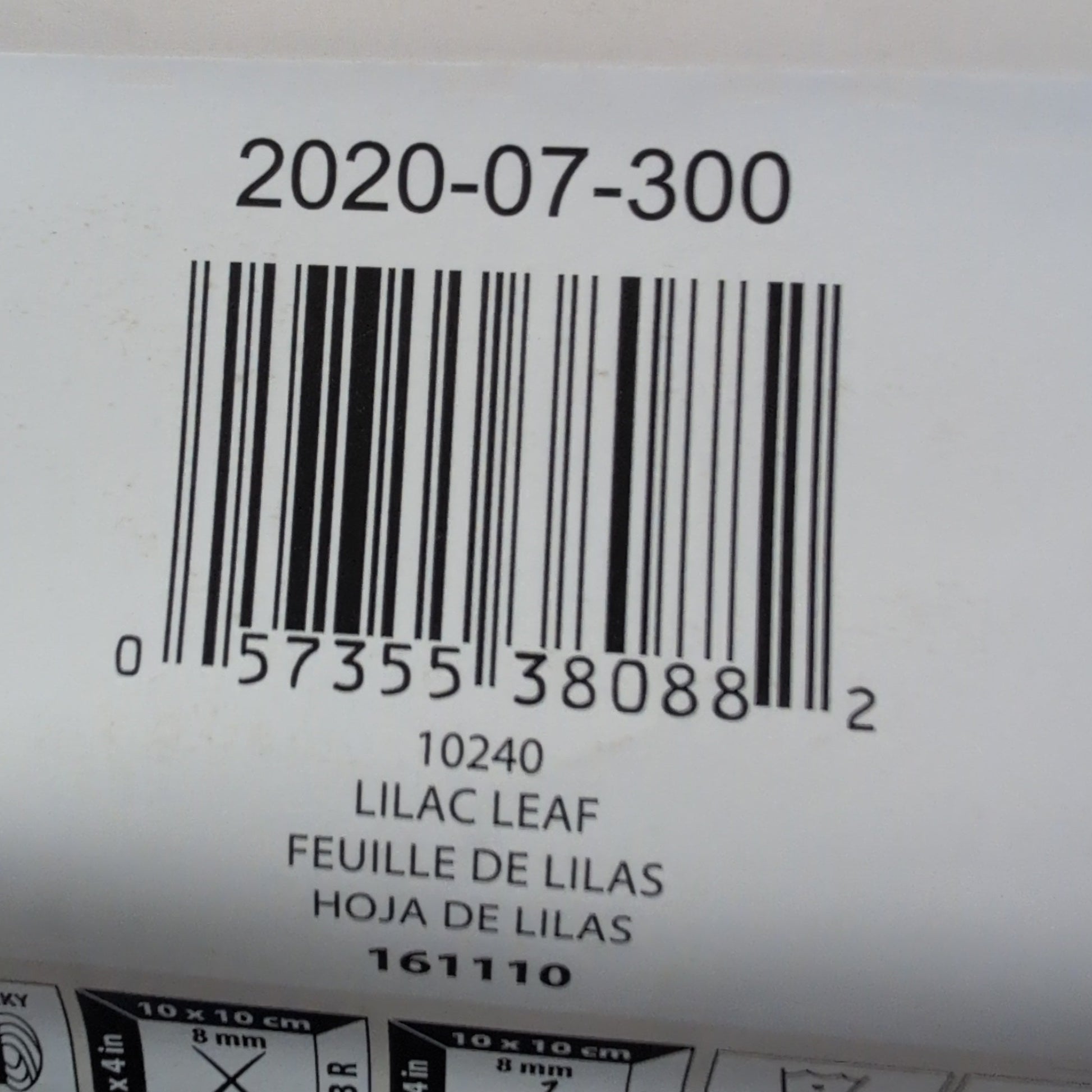 Close-up of a Bernat yarn label with a barcode and product details.