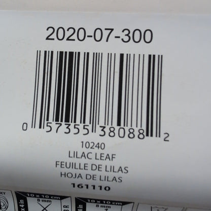 Close-up of a Bernat yarn label with a barcode and product details.