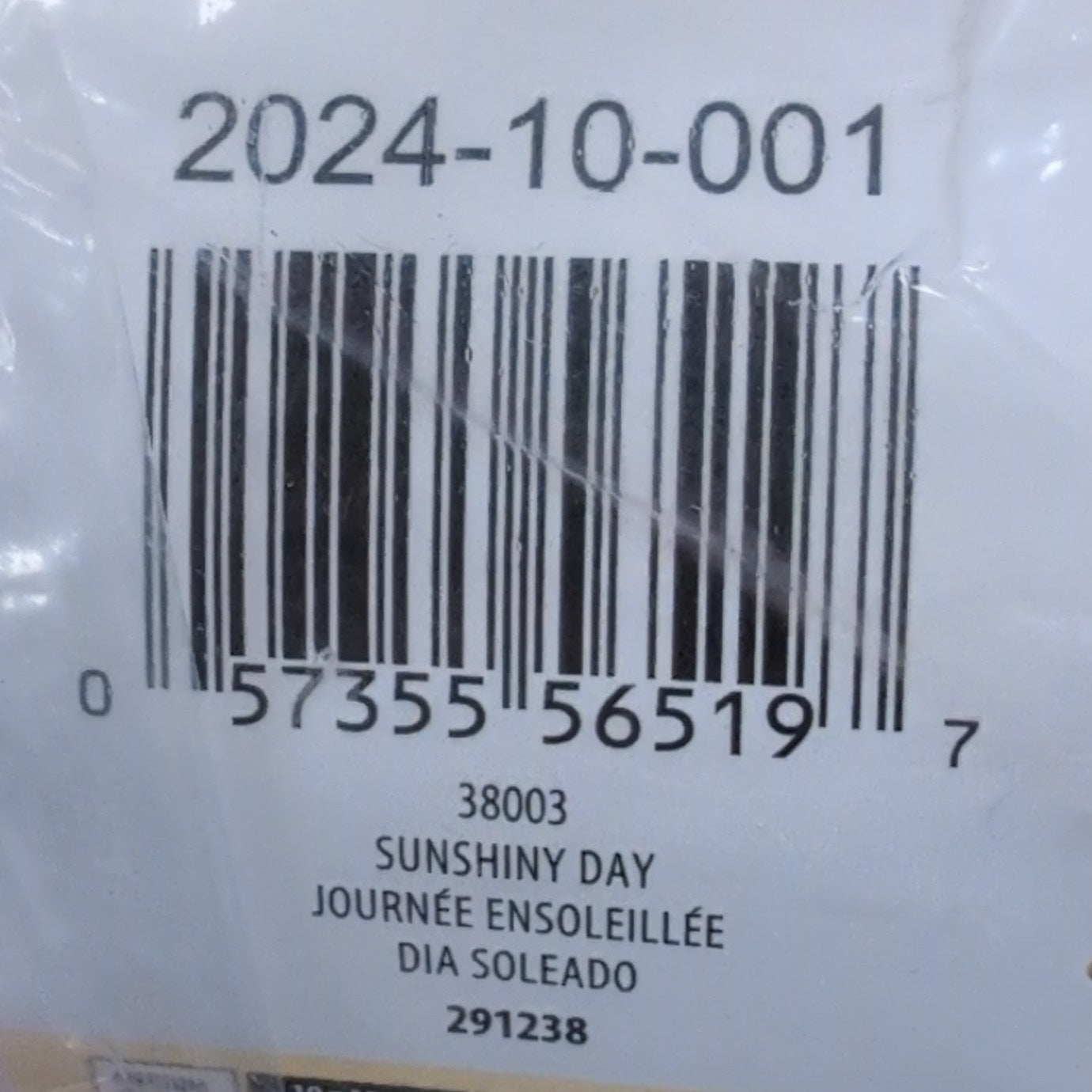 Product in clear plastic packaging with a label and barcode on a wooden surface