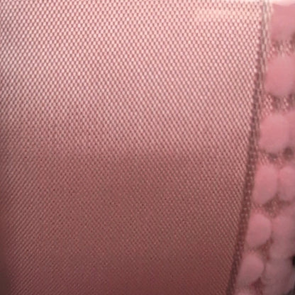 Pink ribbon with a label on a white background
