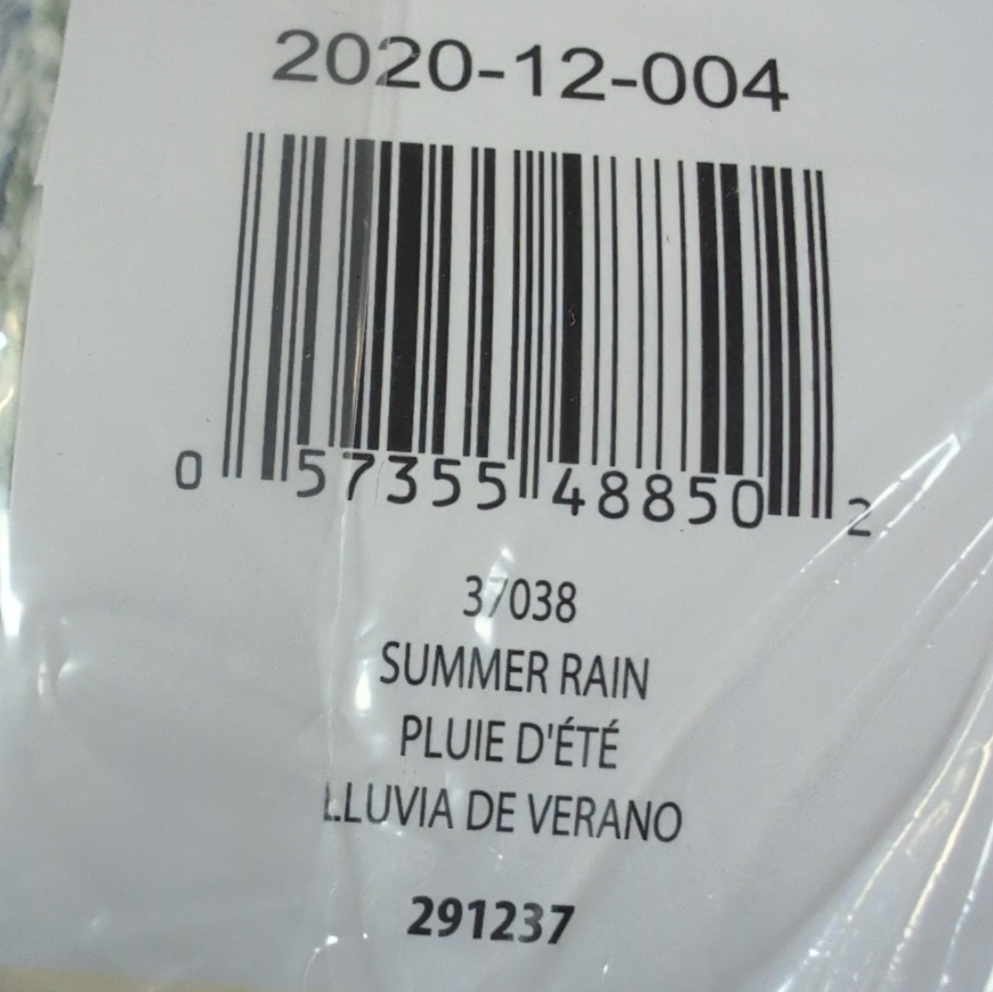 Product in clear plastic packaging with visible barcode and text