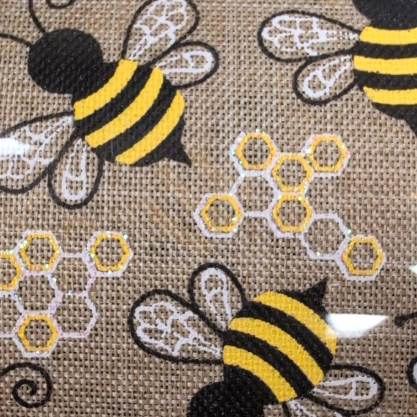 Spool of Kirkland wire-edged ribbon with bee pattern
