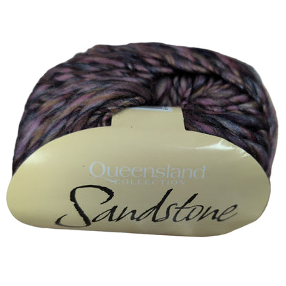 Yarn ball with 'Queensland Sandstone' label on a white background