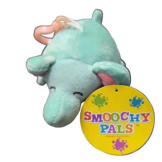 Plush toy hippo with a 'Smooshy Pals' tag on a car seat.